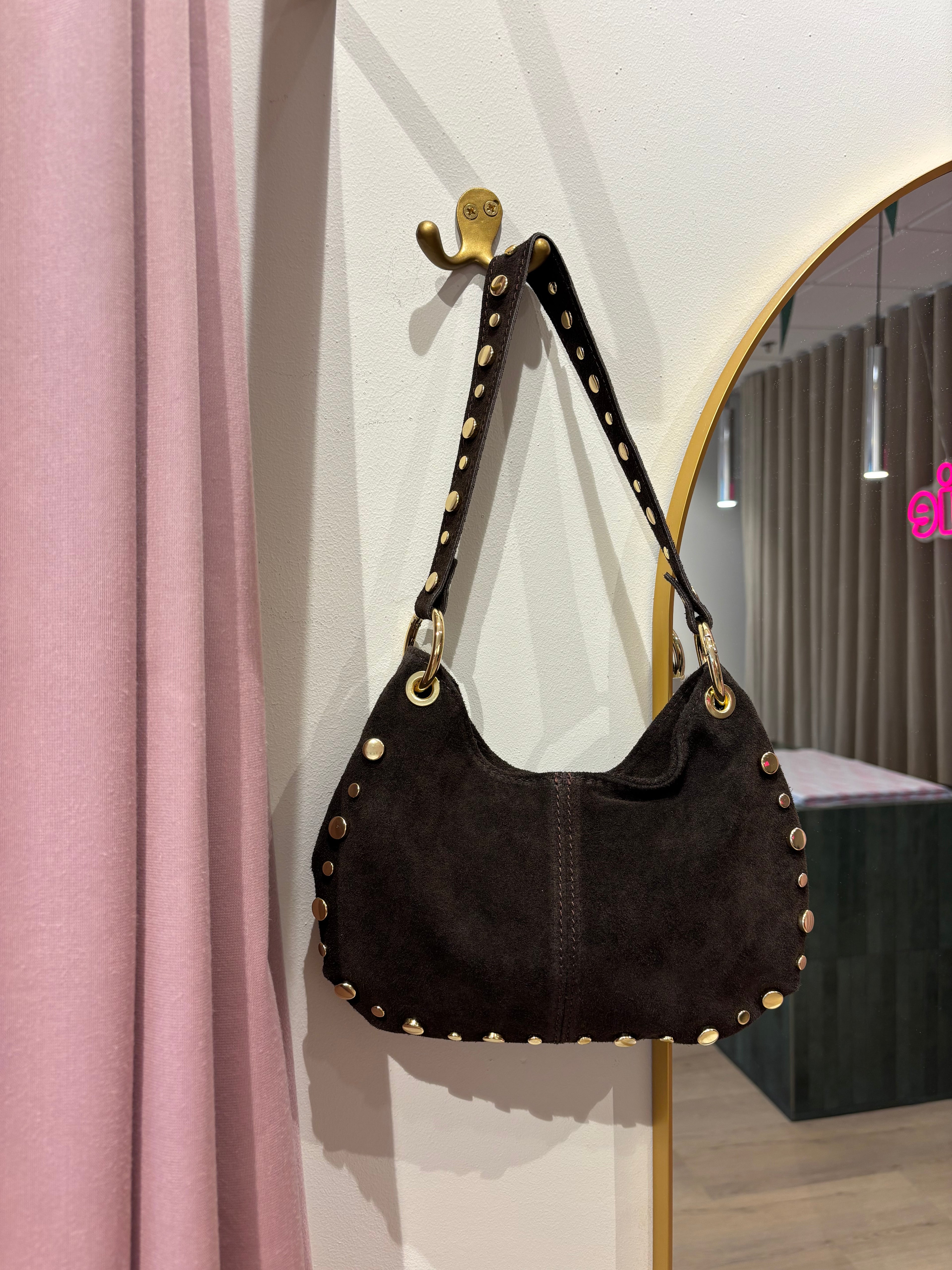 Suède tas met studs